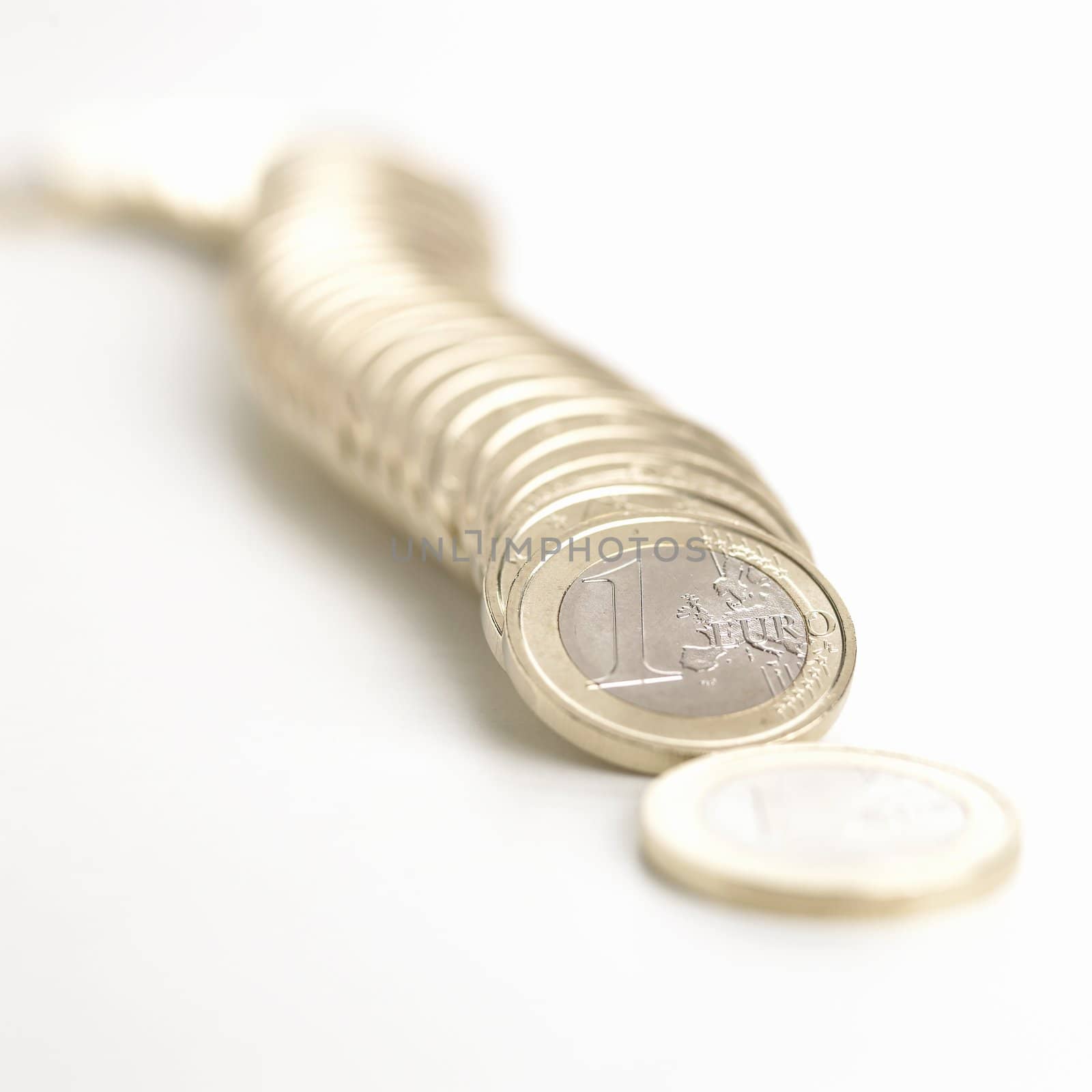 Euro coins on white in a domino effect