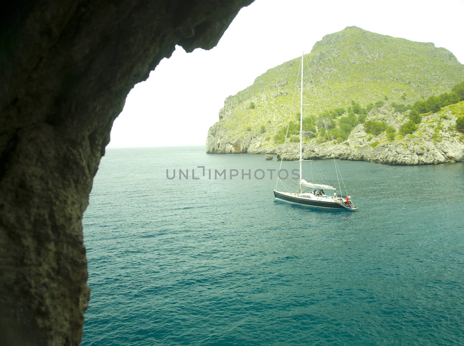 sailing boat in a lonley ocean bay in mallorca spain