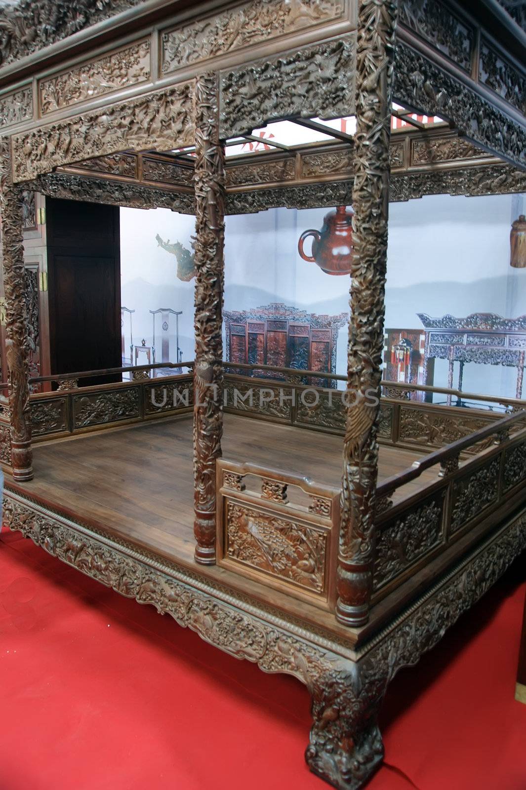 The entire bed from top to bottom inside and out covered with carved patterns