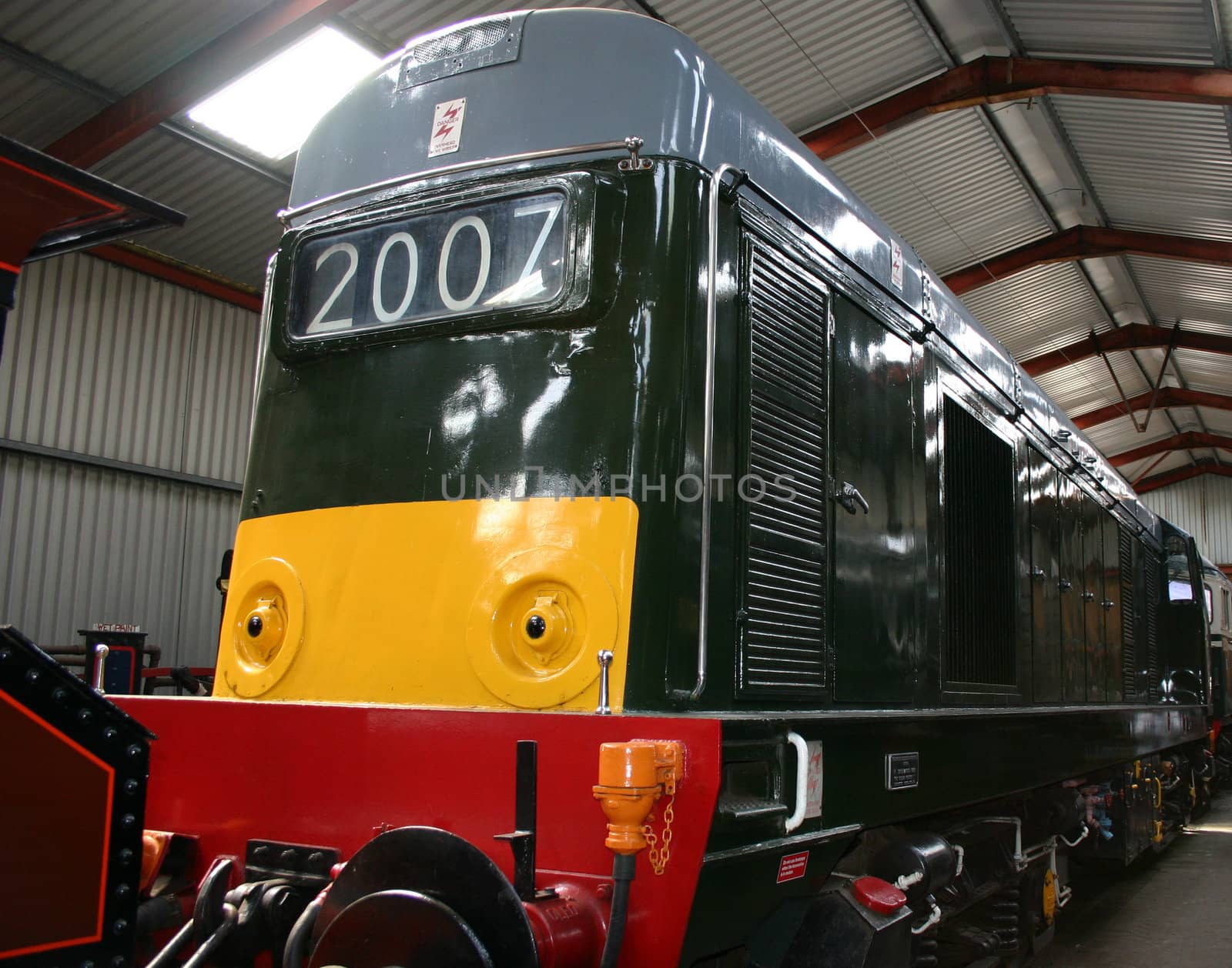 diesel locomotive in a storage shed all restored for the tracks