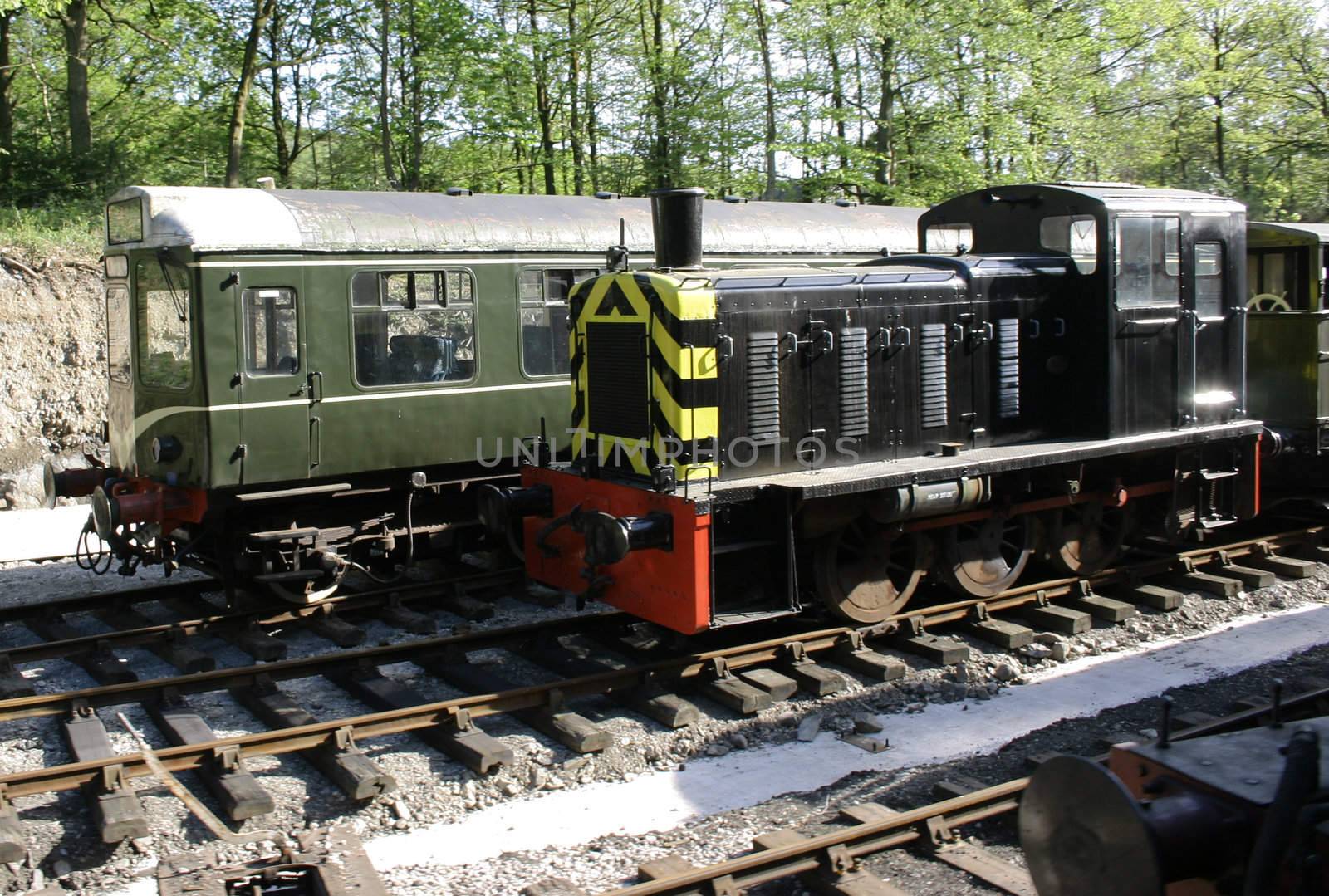 black diesel train and green diesel train