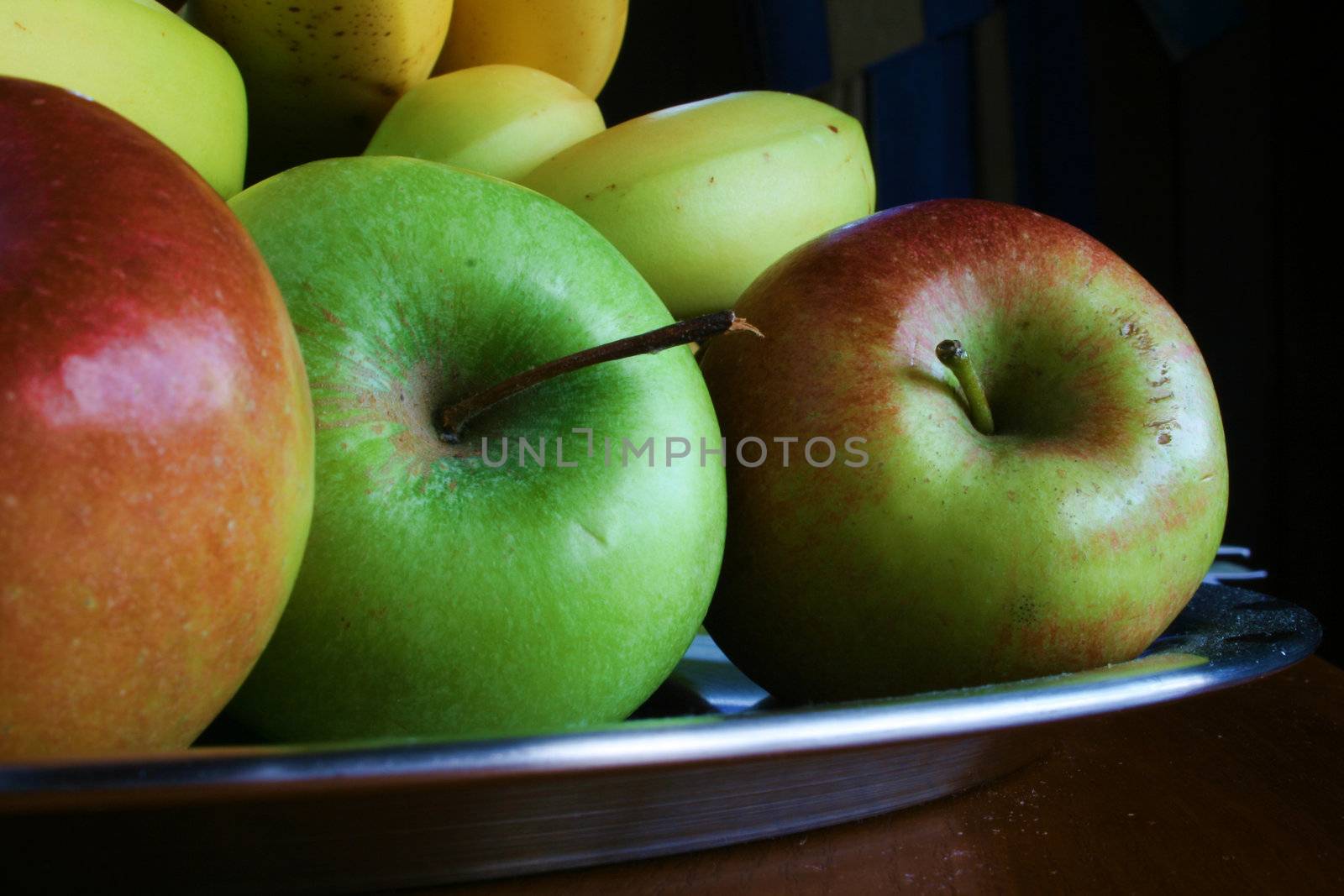 fresh fruit on a silver tray using natural light