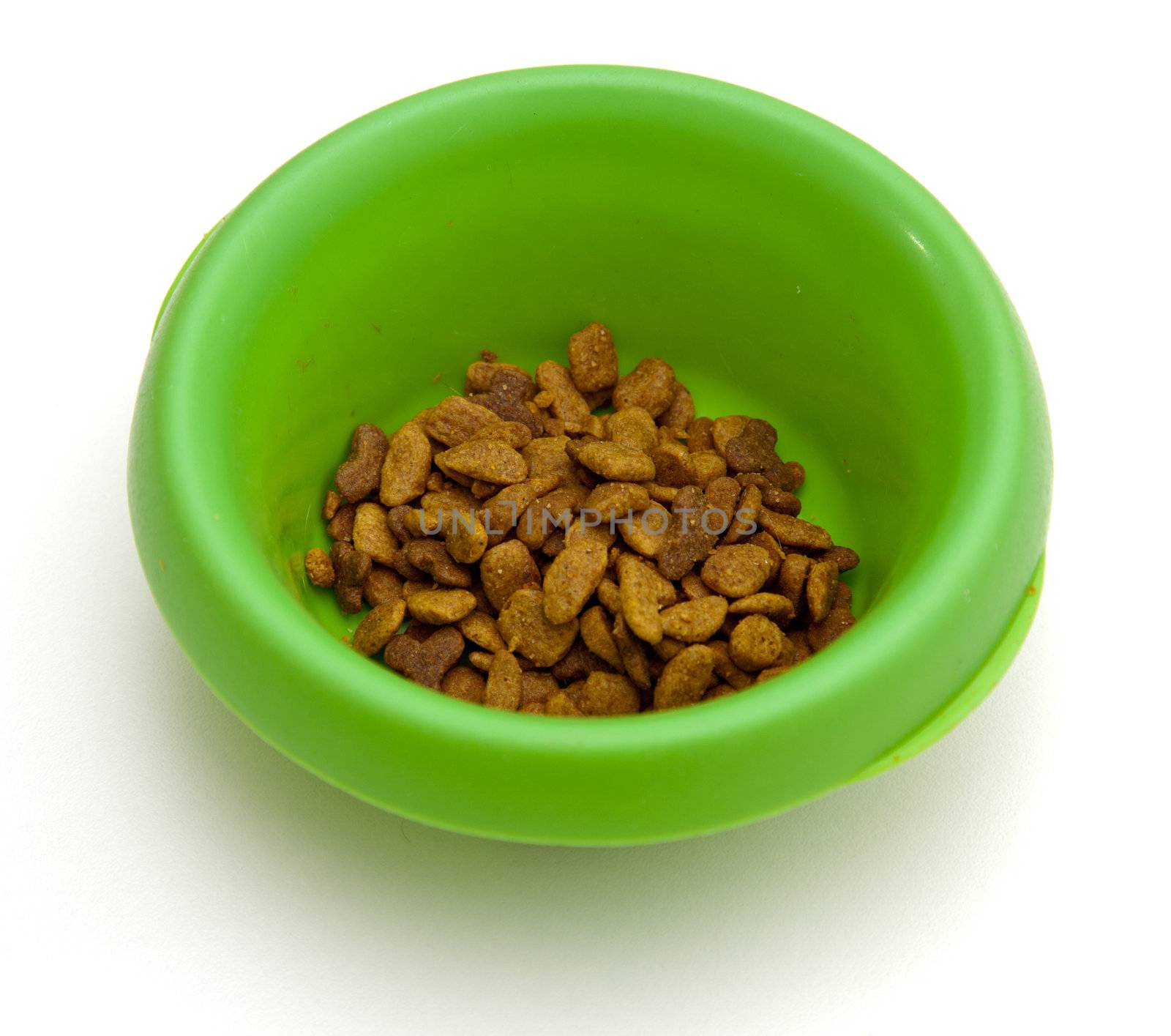 Green pet bowl with biscuits by steheap