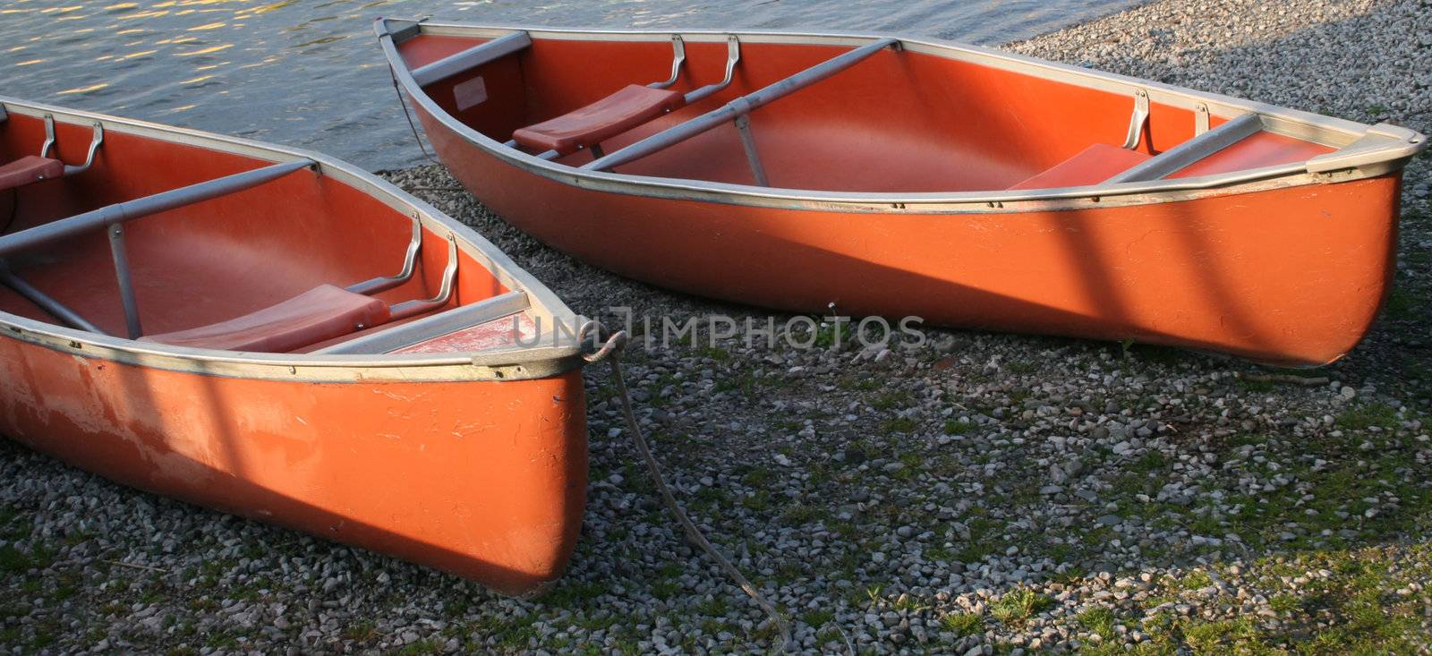 canoes in the morning light by leafy