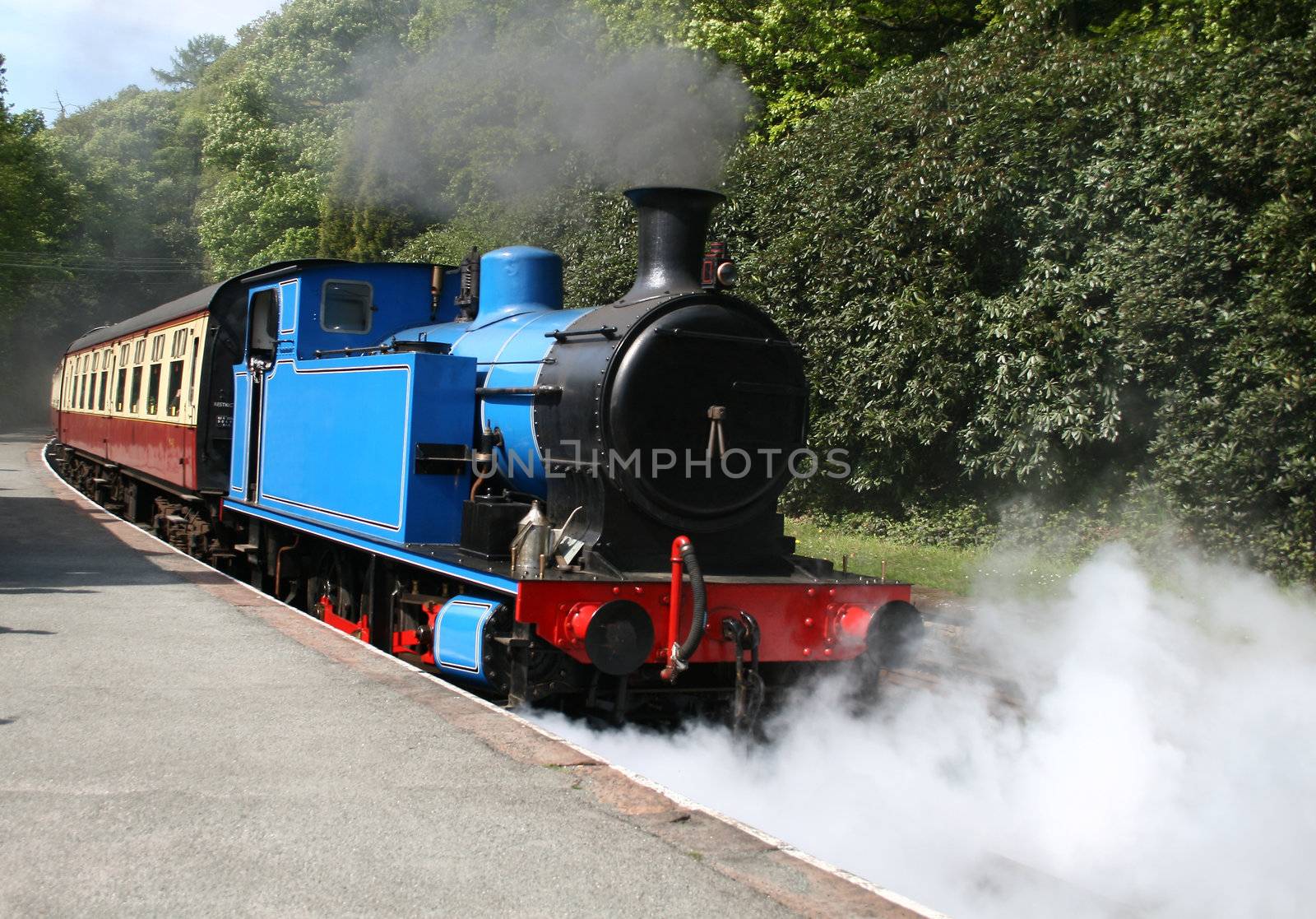 steam locomotive with steam and smoke