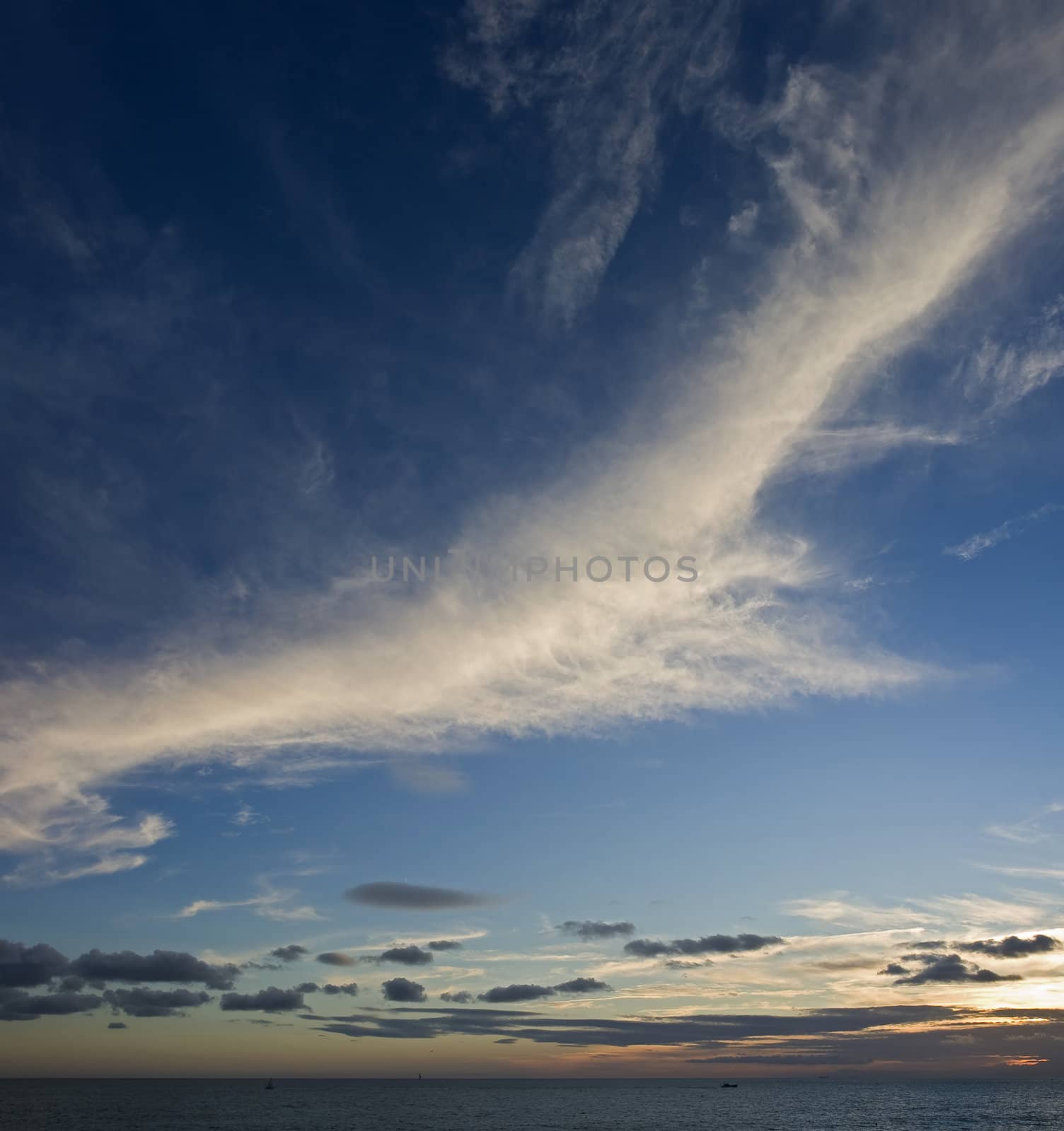 Clouds lit during a beautiful sunset in Genoa