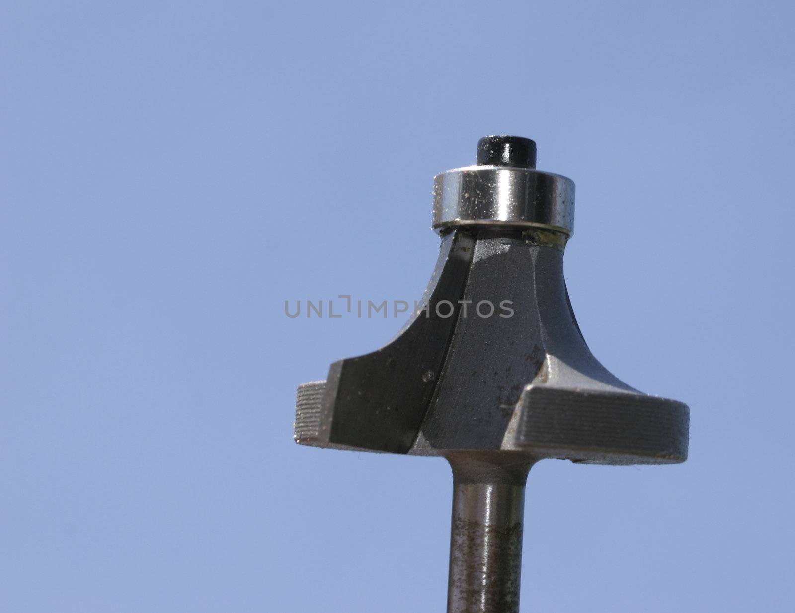 a router bit against a blue background