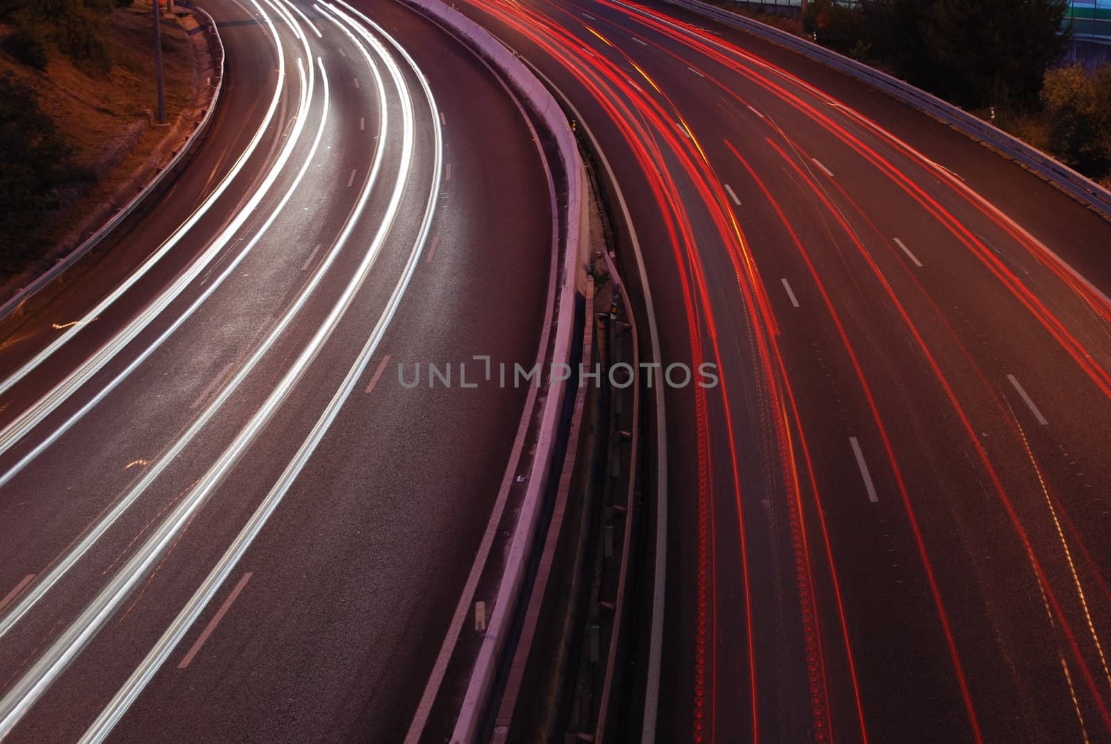 a night time shot of speeding traffic on a freeway