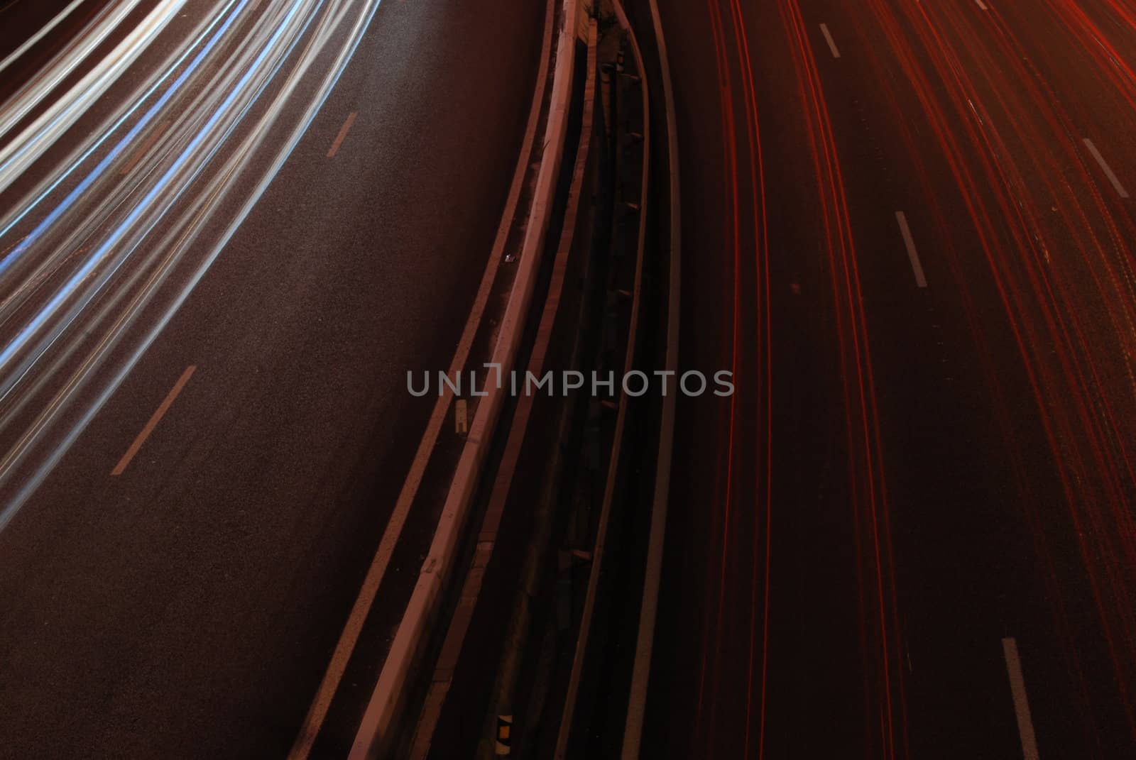 a night time shot of speeding traffic on a freeway