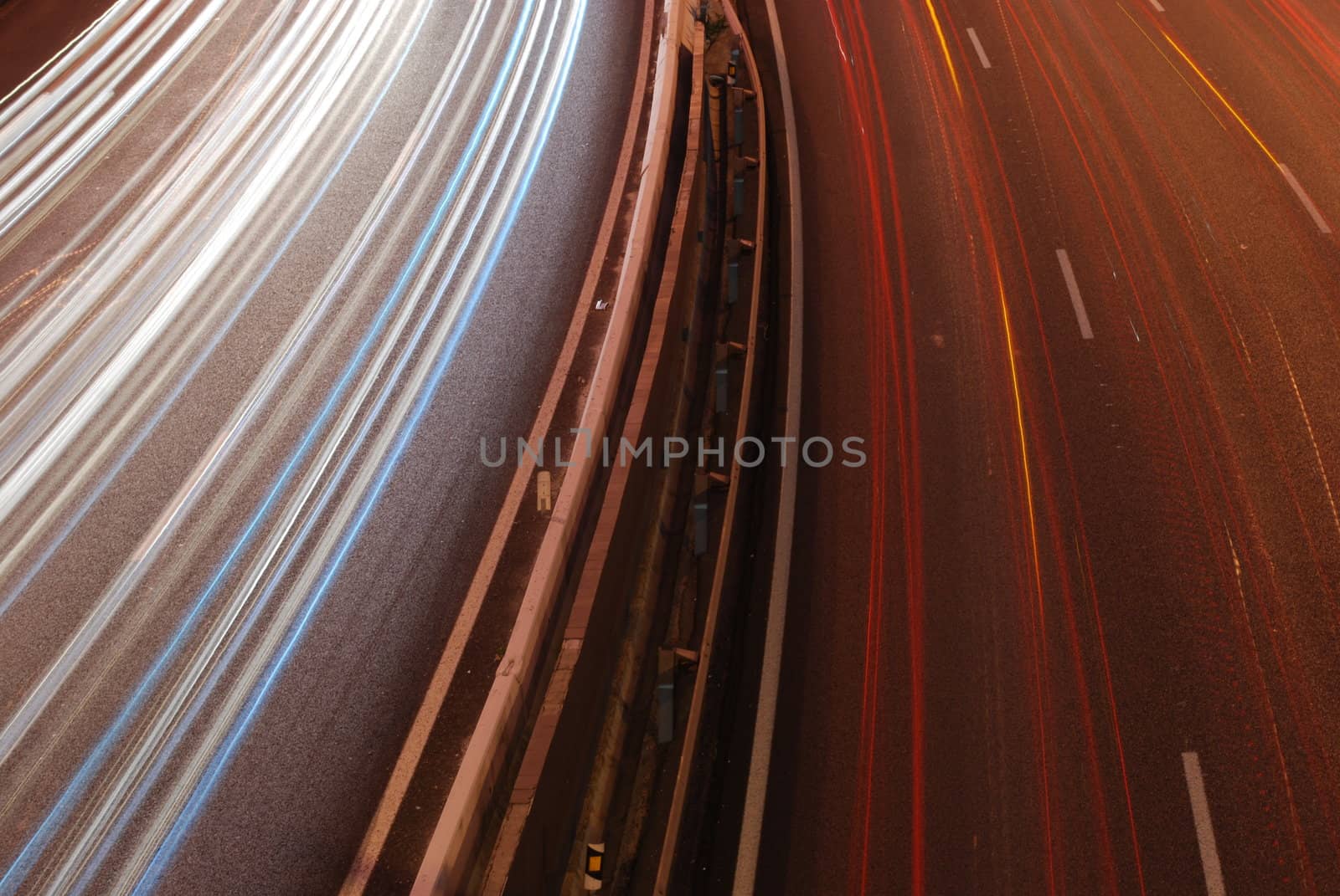 a night time shot of speeding traffic on a freeway