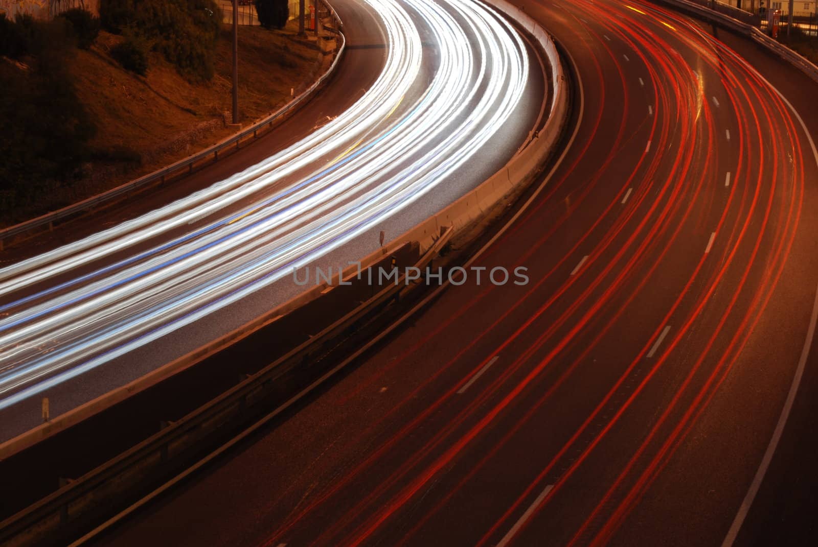 a night time shot of speeding traffic on a freeway