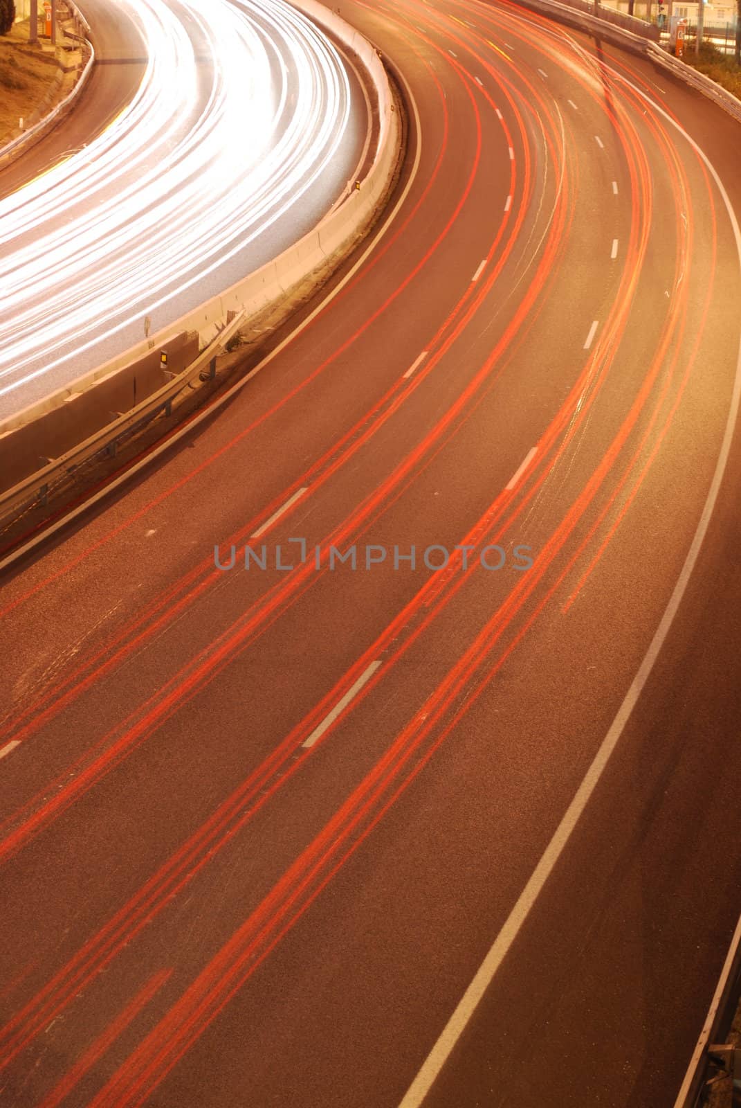 a night time shot of speeding traffic on a freeway