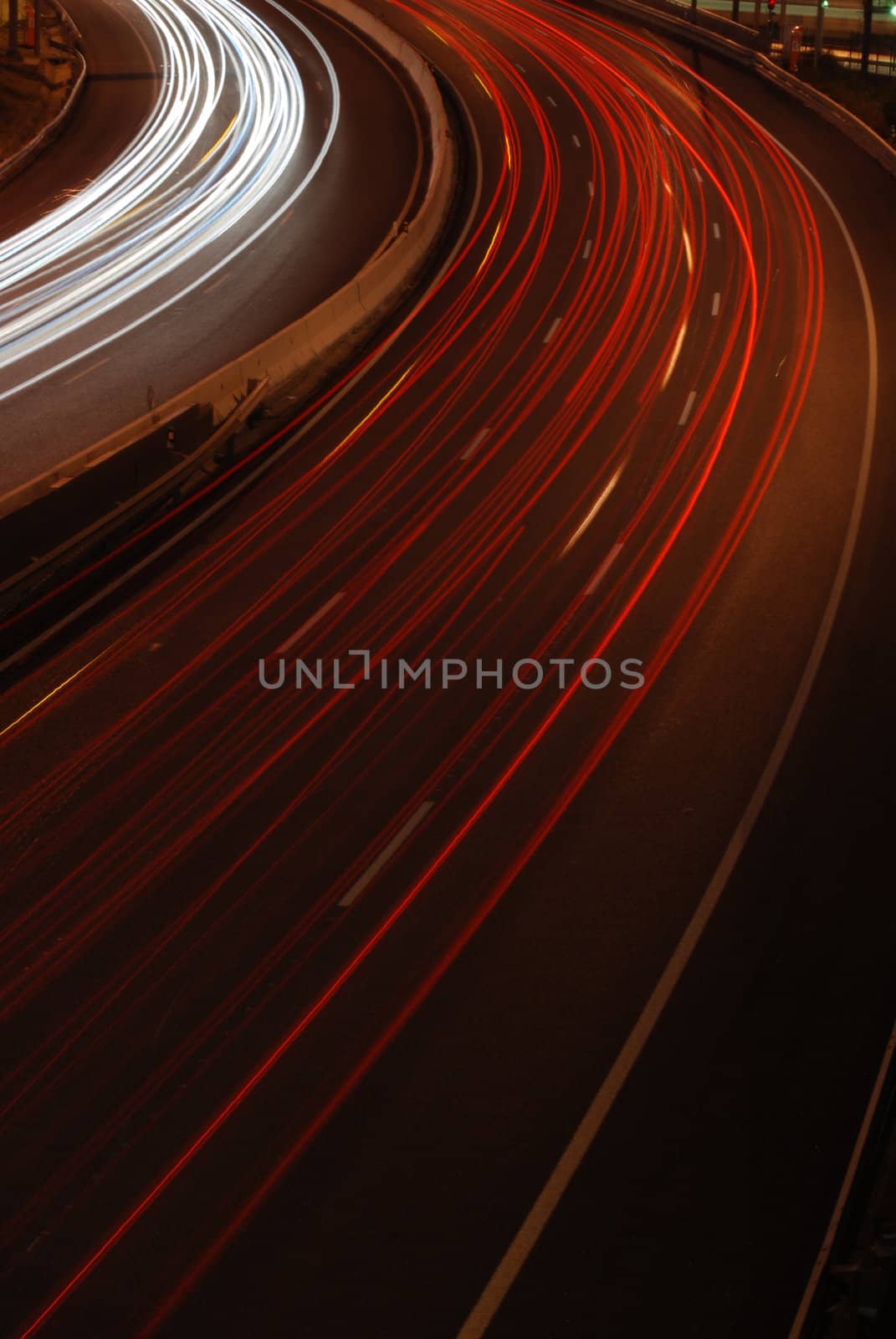 a night time shot of speeding traffic on a freeway