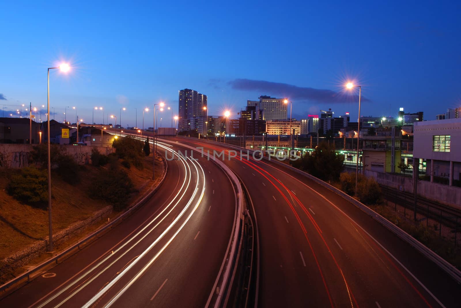 a night time shot of speeding traffic on a freeway