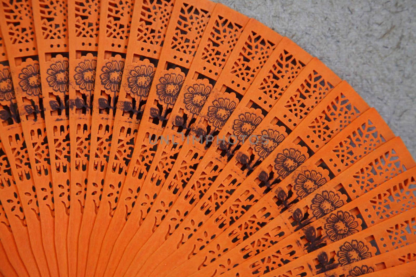 Close-up of a bright Asian fan.