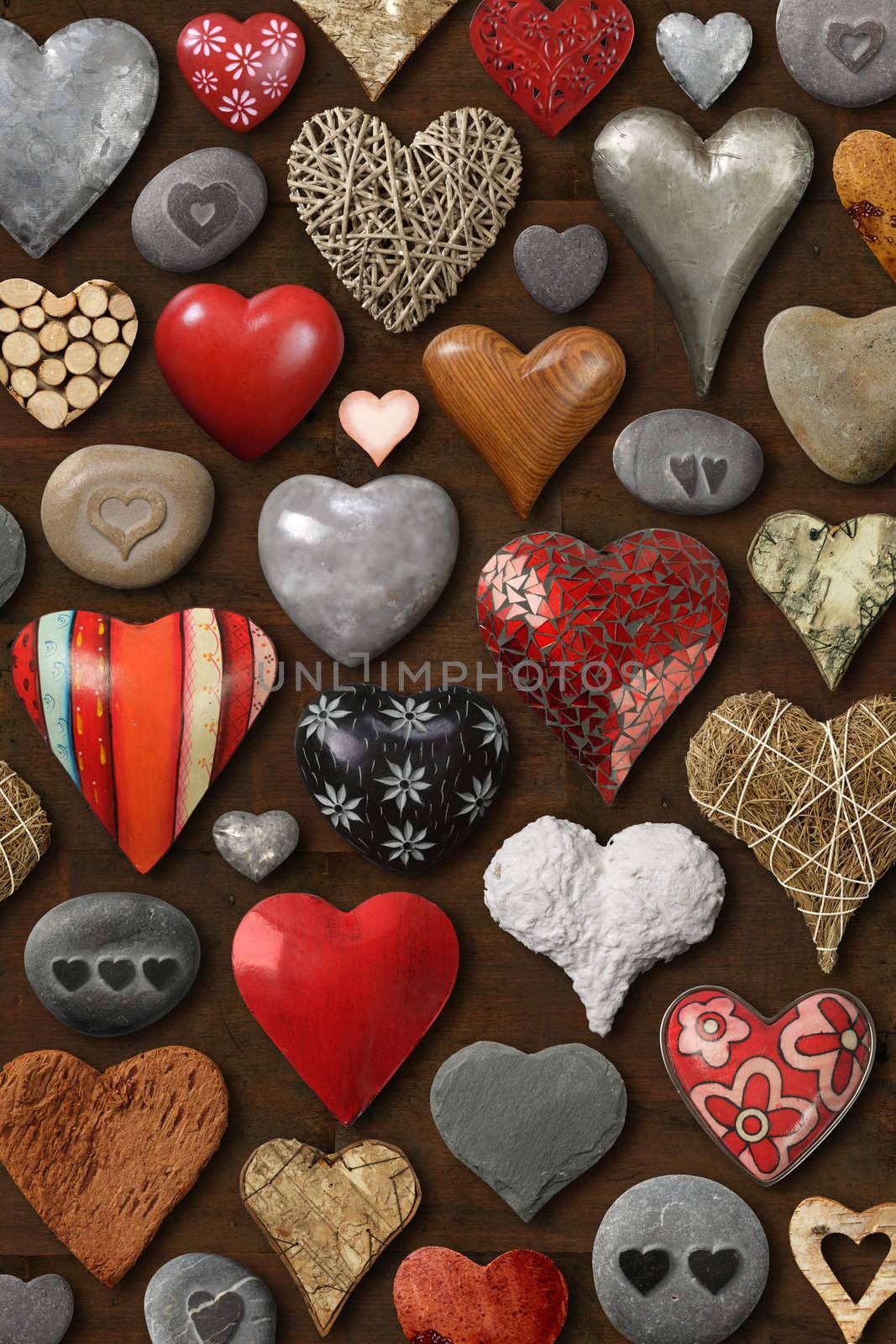 Background of heart-shaped things made of stone, metal and wood.