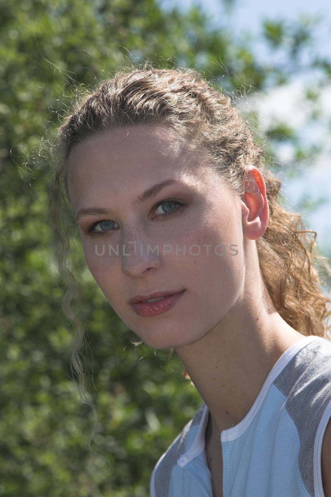 Beautiful woman outdoors in the sunshine