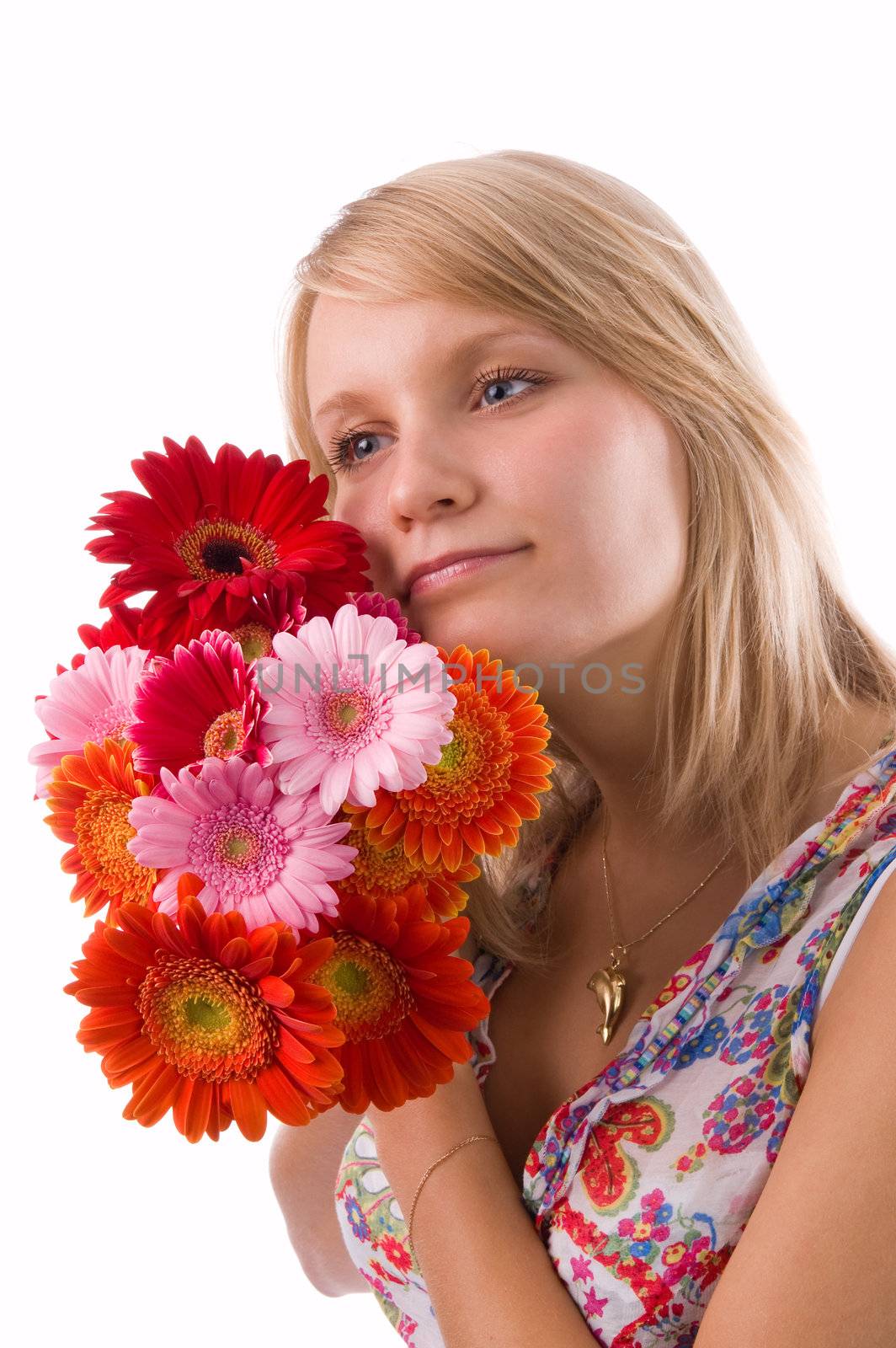 The beautiful blonde holds flowers in hands