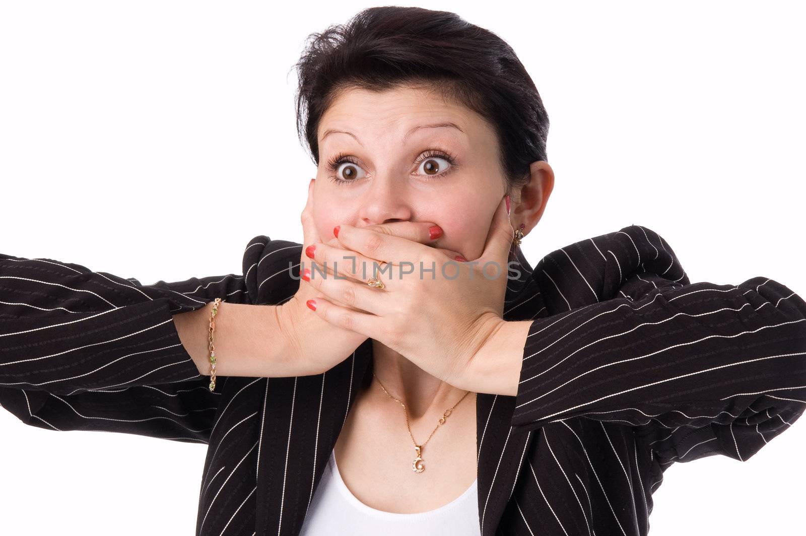 The woman in a business suit clamps hands a mouth