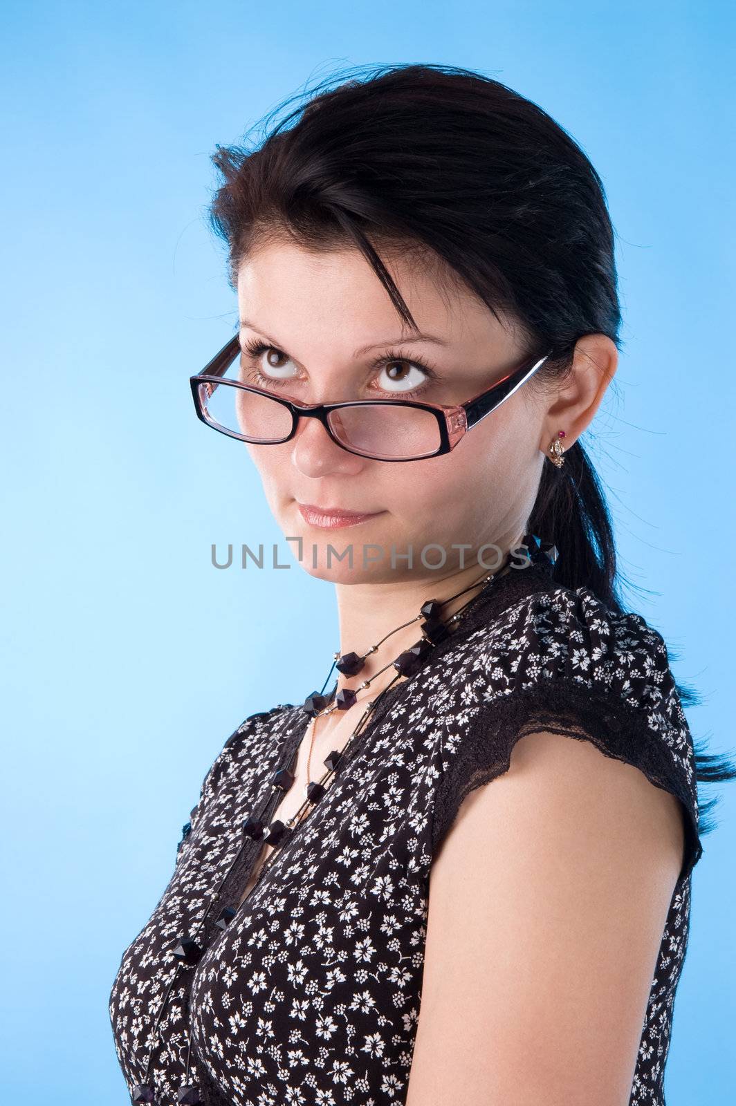 The attractive woman with the glasses, rather like the teacher