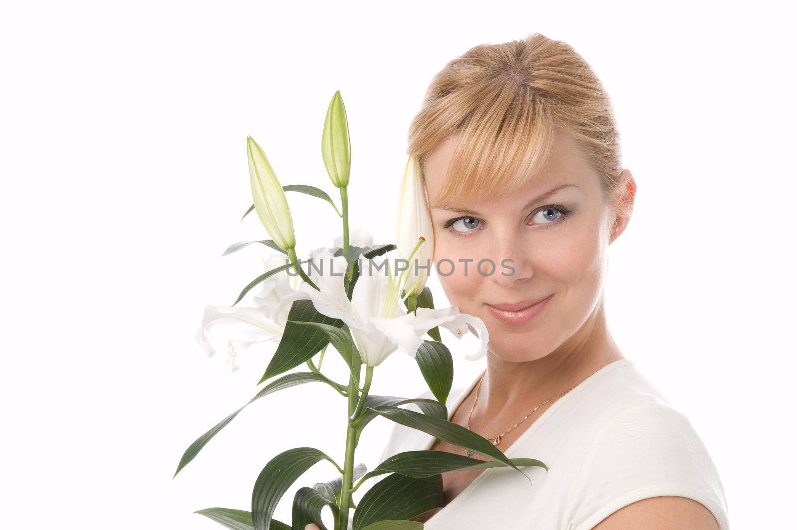 The attractive girl holds a liliy in hands
