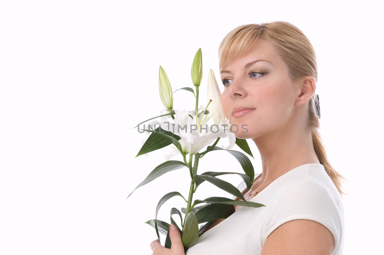 The attractive girl holds a liliy in hands