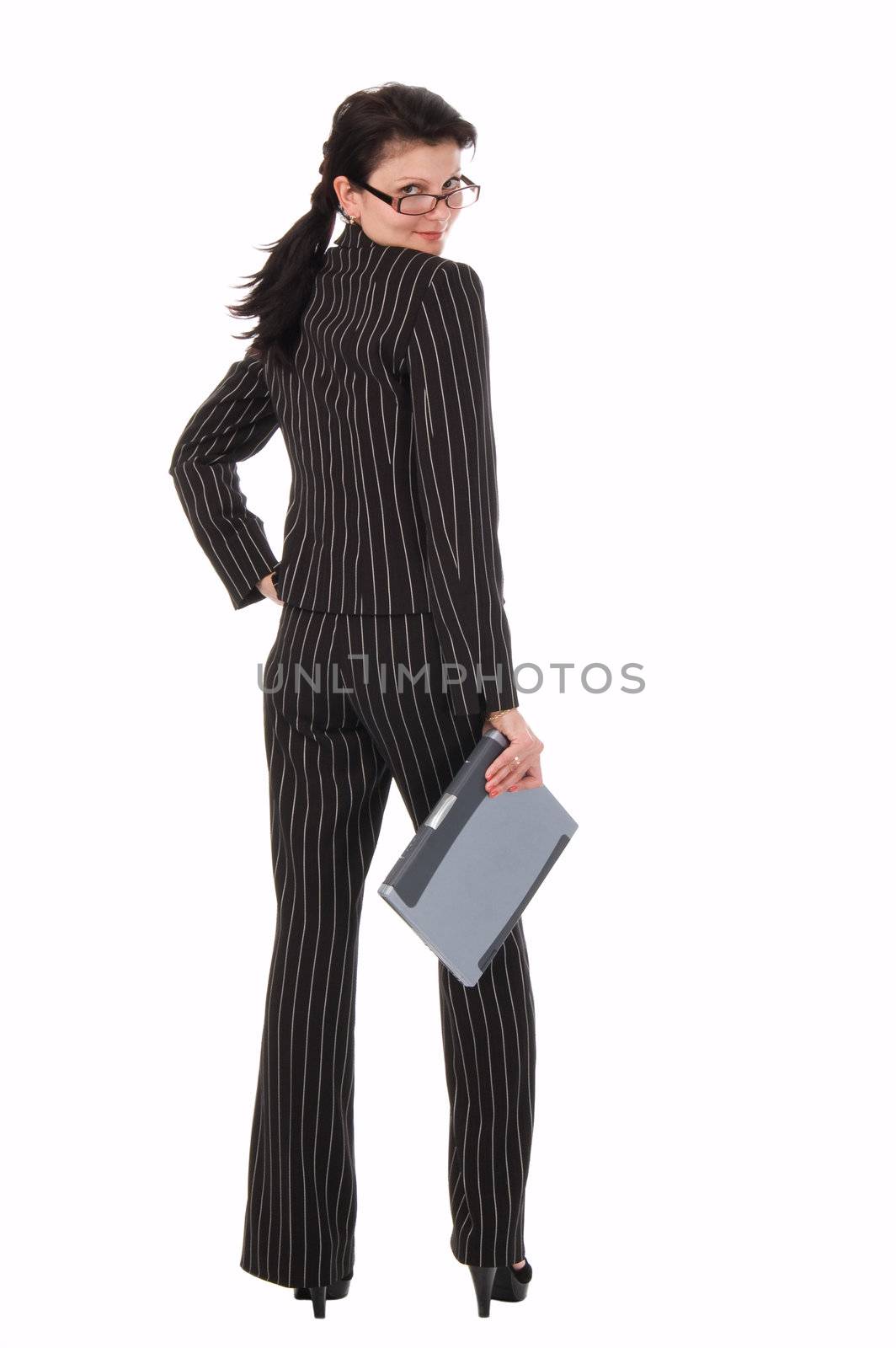 The woman in a business suit with notebook looks back