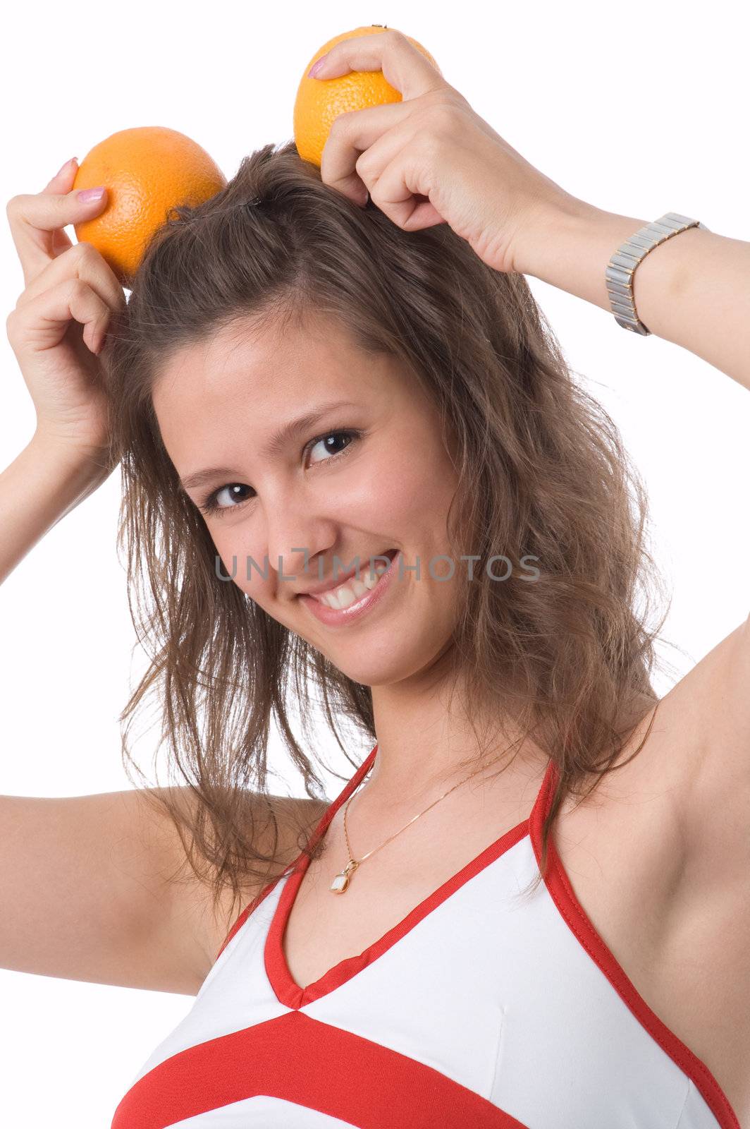 The brown-eyed girl on a white background holds oranges