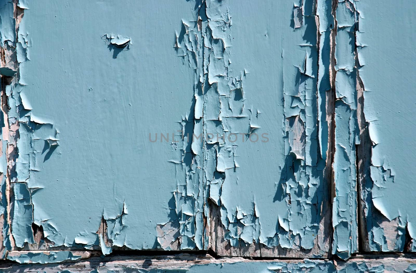 Peeling paint on the front of an old door