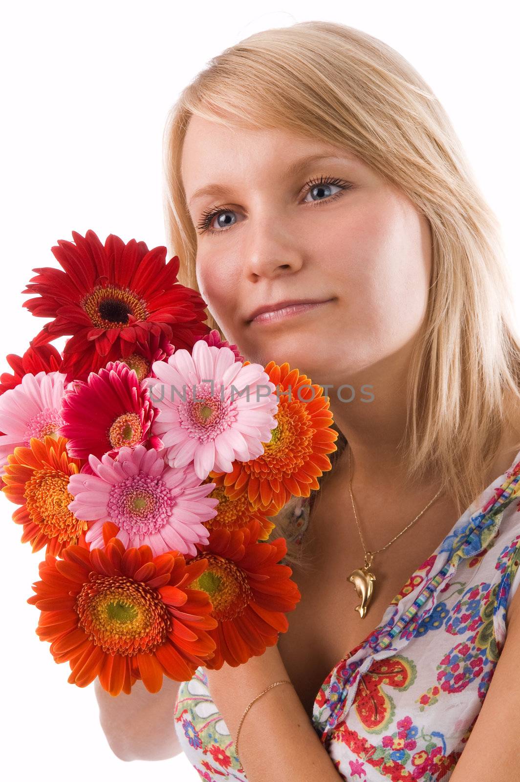 The beautiful blonde holds flowers in hands