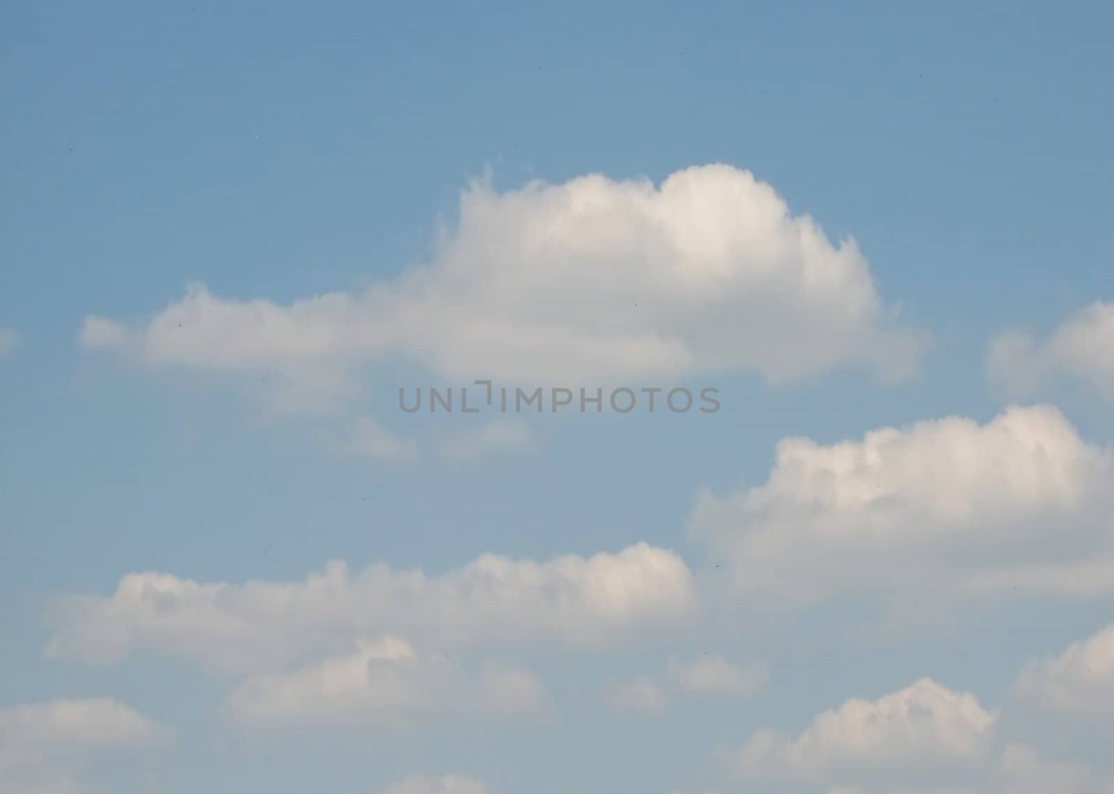 Sky with fluffy clouds, usable as background