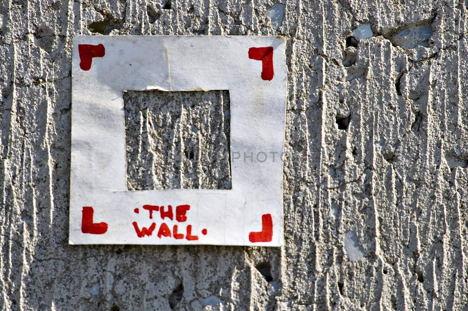 Paper label on a cement wall