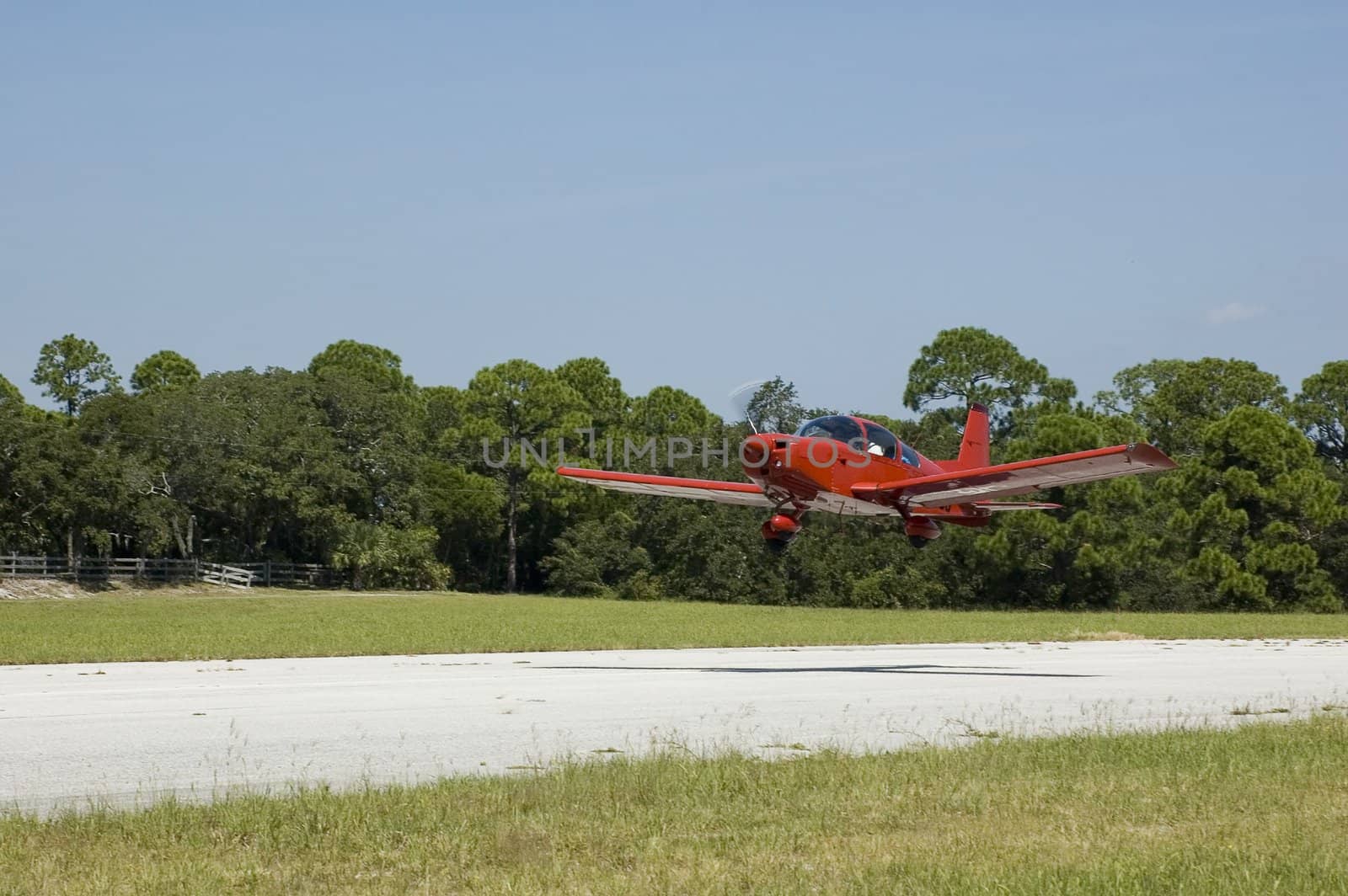 A private plane takes off from a small airport.