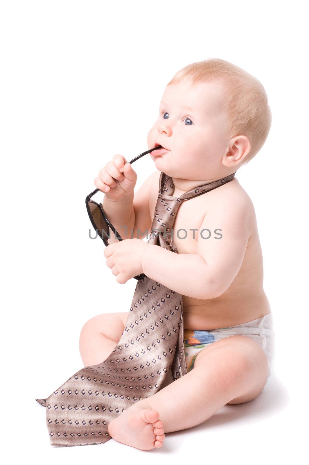 The small child in studio, on a white background