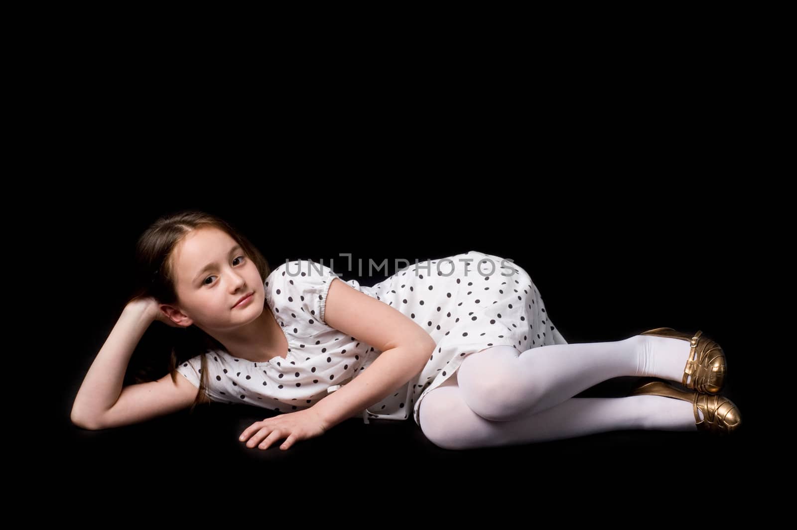 The girl in studio on a black background