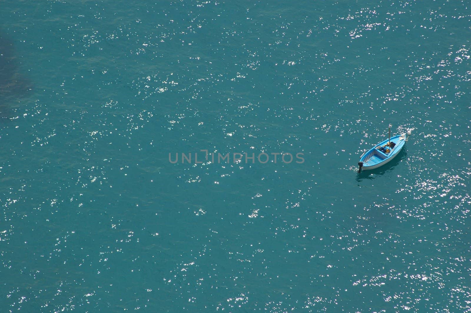 Wood boat in the blue sea