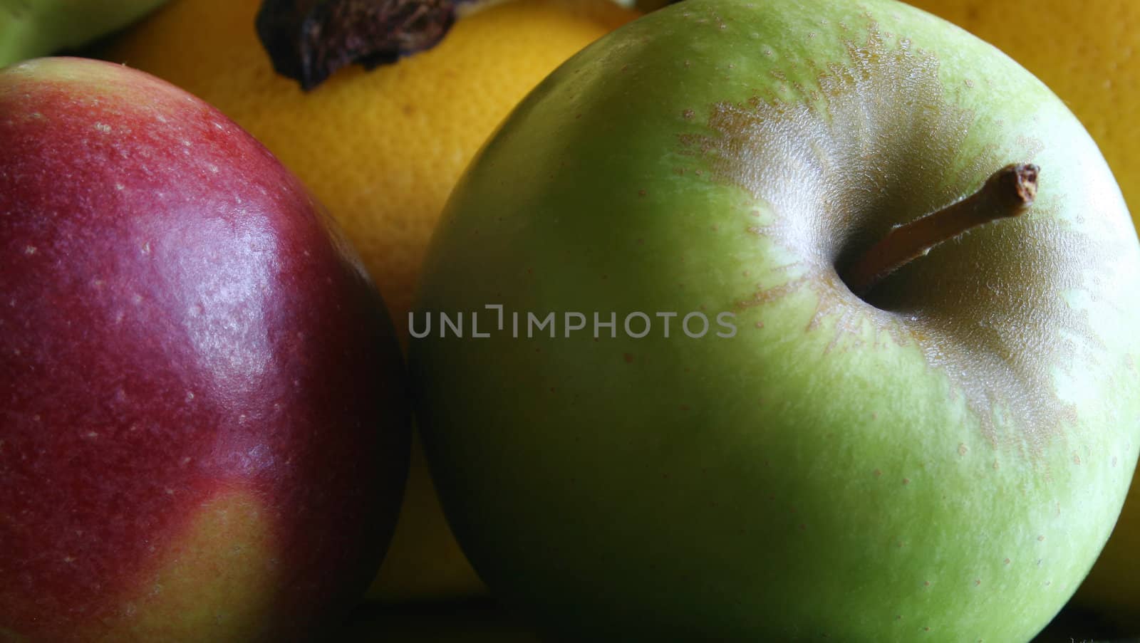 green apple take with natural light and a dark background