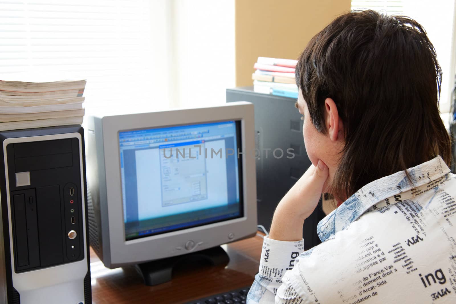 Closeup of man working on computer - face looking at monitor