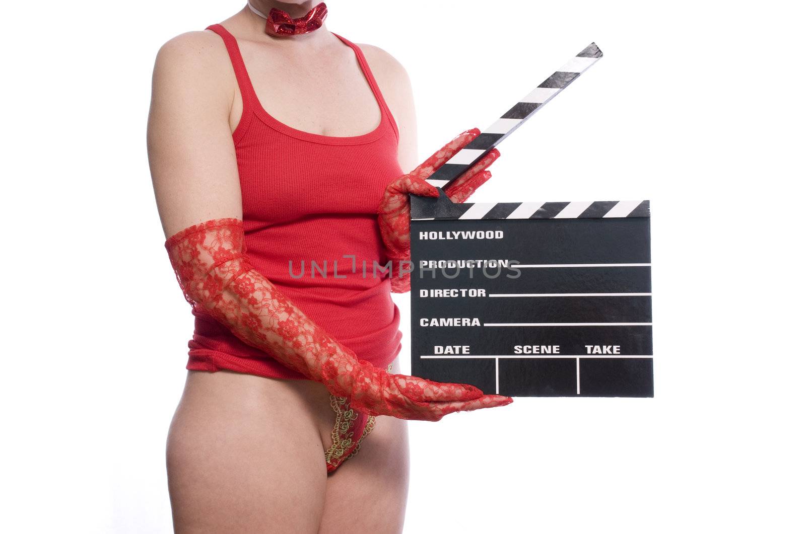 sexy womans body holding a movie clapper on white