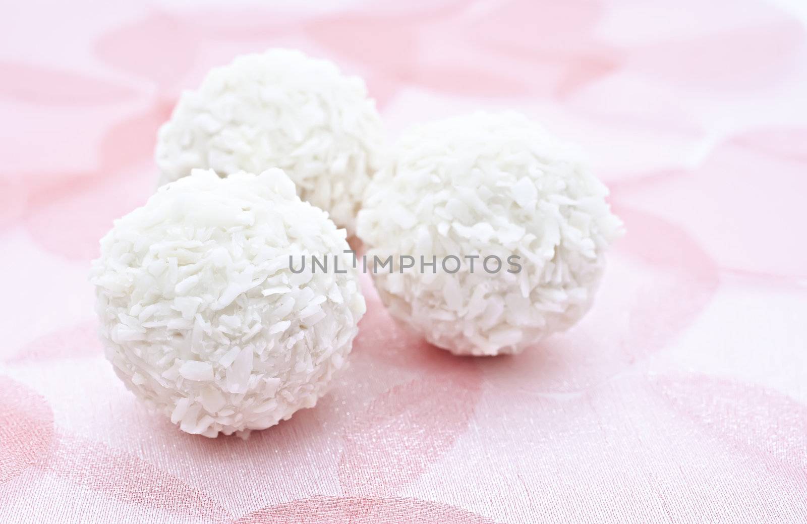 Coconut candy to the romantic pink background.
