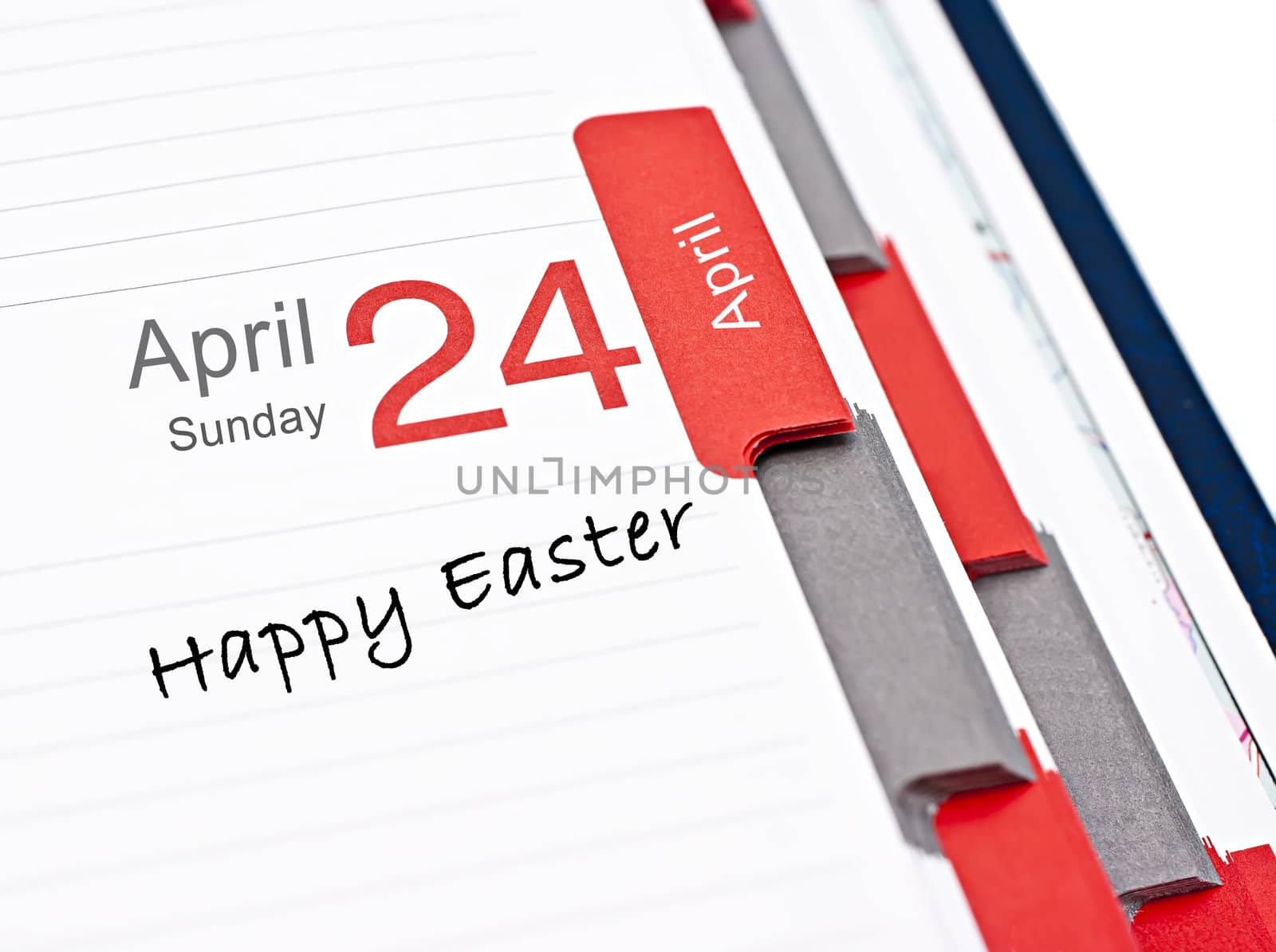 Notebook calendar open on April 24, with the words Happy Easter.
