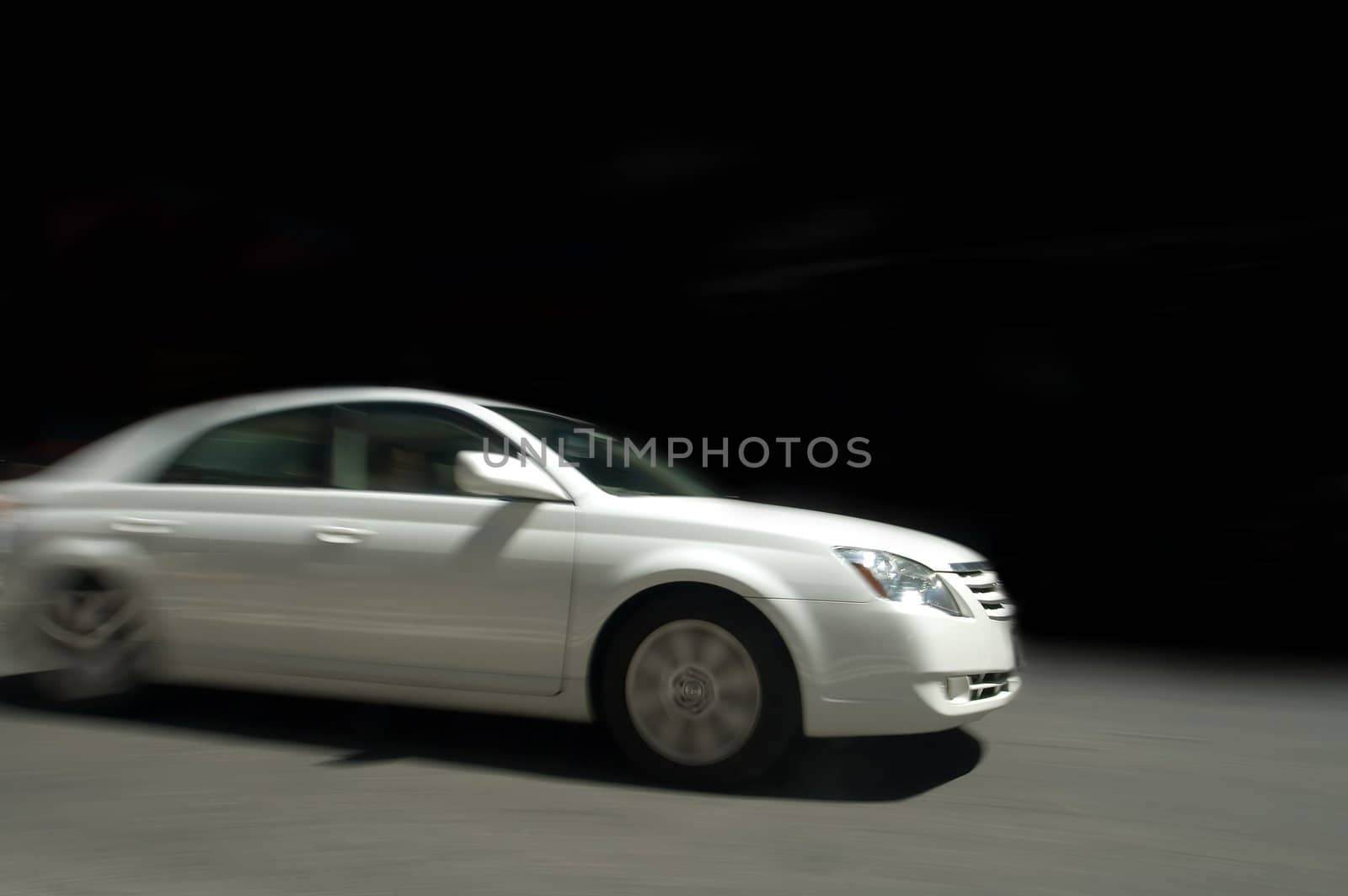 white car in speed, motion blur, black background