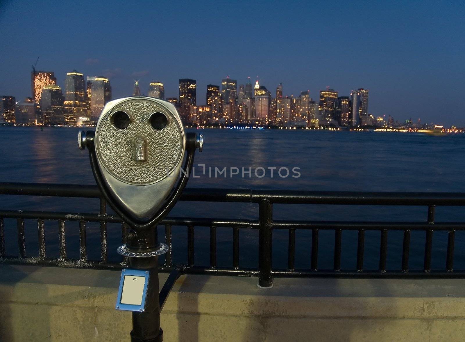 steel coin binoculars and new york in background, dusk, photo taken from new jersey