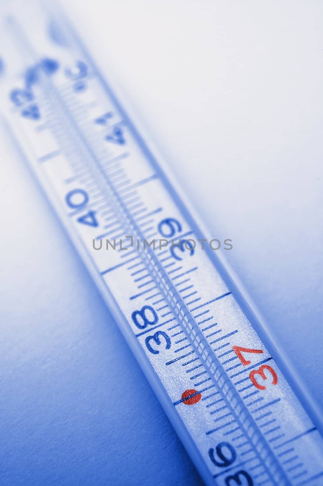 picture of blue colored thermometer, 37 degrees in red color