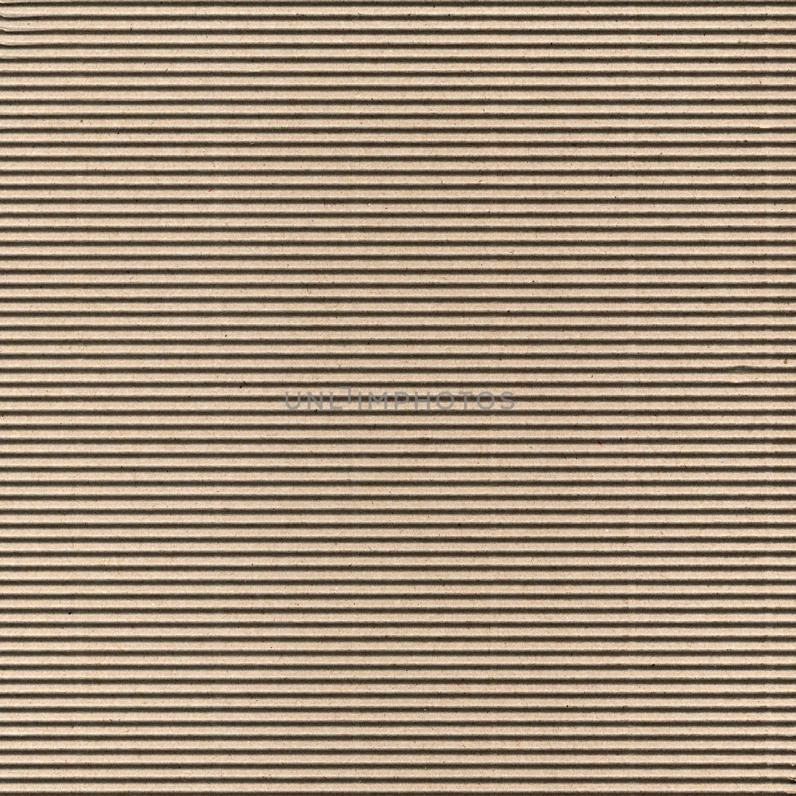 Seamless brown corrugated cardboard sheet useful as a background