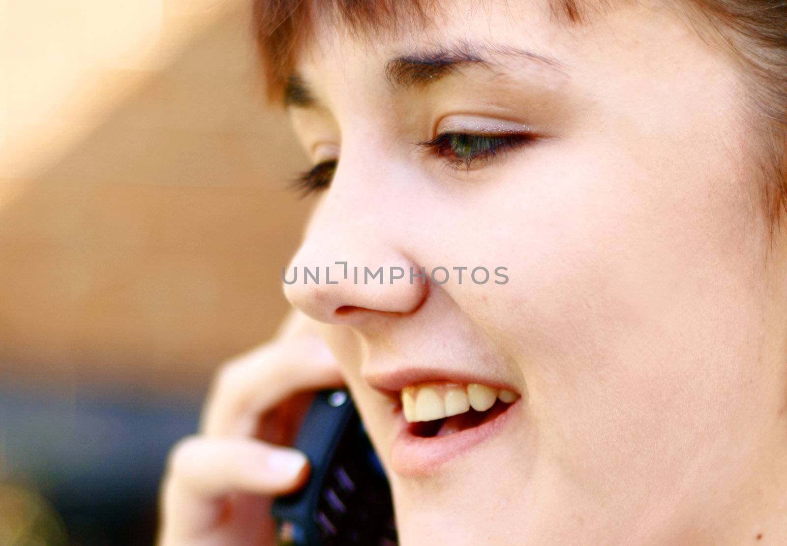woman on the phone by leafy