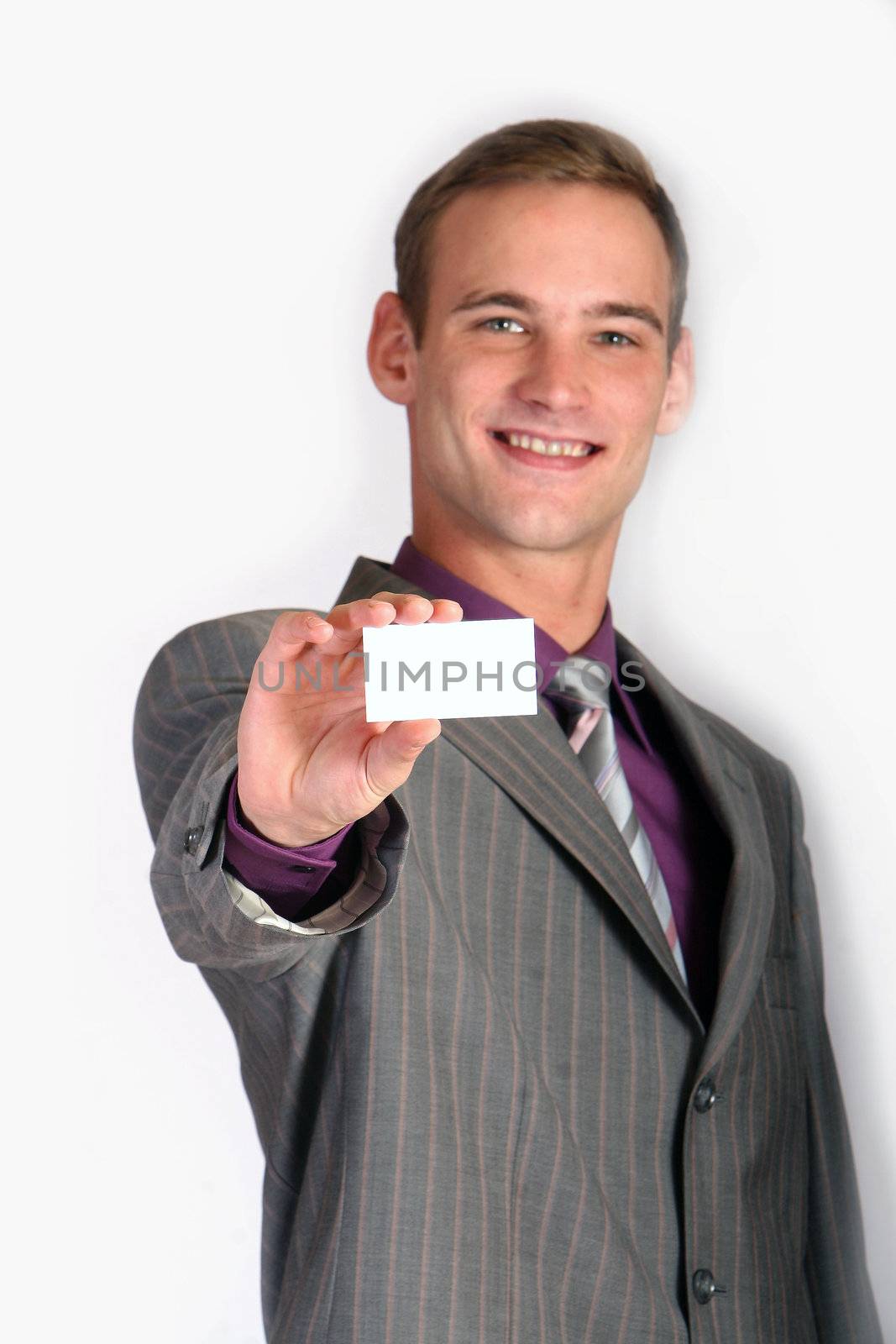 a businessman ist holding his card
