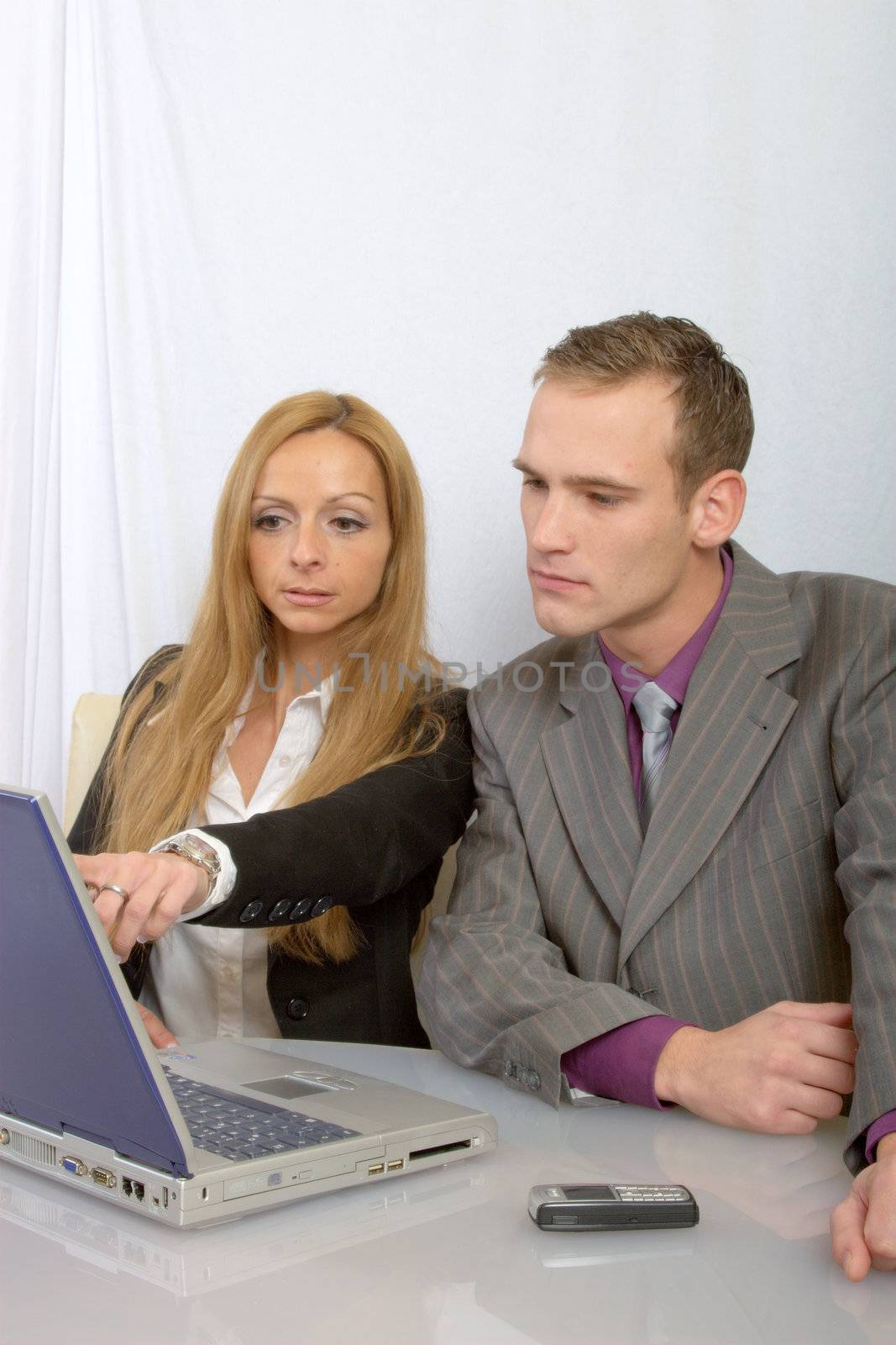 a happy business team at work- two persons