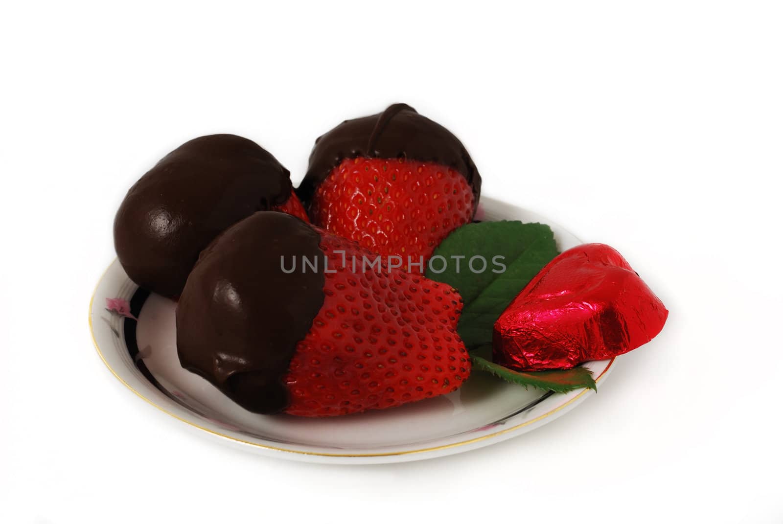 Strawberries in dark chocolate isolated on white background
