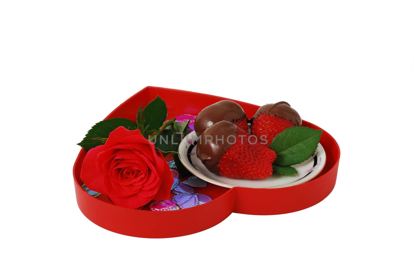 Strawberries in chocolate on red heart shaped tray with rose isolated on white background